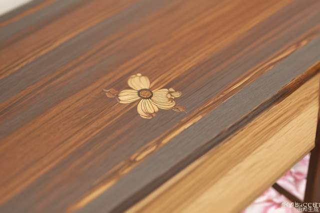 Wooden Table Close-up, wooden table on table in front ofa room with flowers, in the style of song dynasty, videoglitches, mirror, precise, detailed architecture paintingsbokeh, dark gray and bronze, clean lines, pure forms